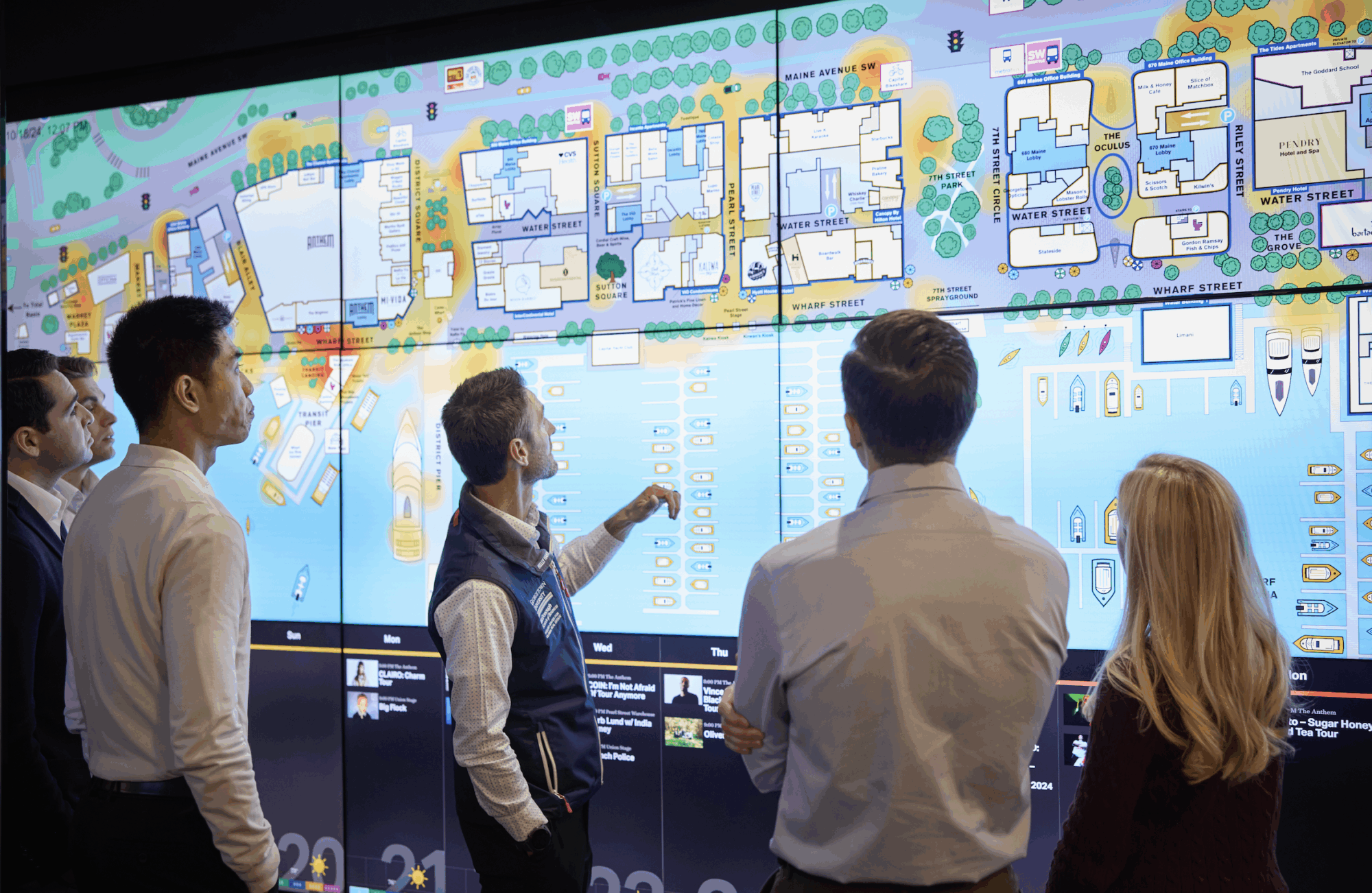 Director, Matt Cypher, and Steers Global Real Assets students viewing a heat map of the Wharf in Washington, D.C.